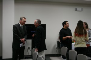Rick Ludwin (left) chatting with Senior Library Technician Jim Bricker (right) after his talk