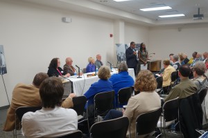 Jacky & Jerome next to the panel of speakers