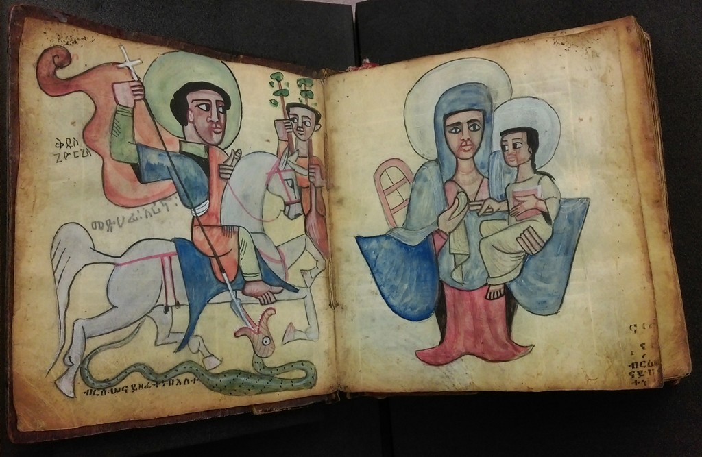 Art from inside the prayer book. Definitely Mary & Jesus on the right, possibly St. George on the left?